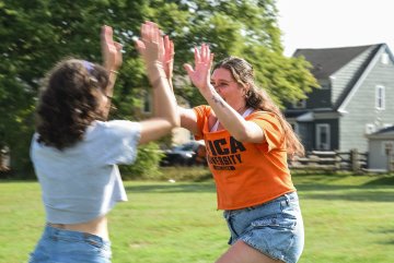 Athletes playing Spikeball at Homecoming 2025