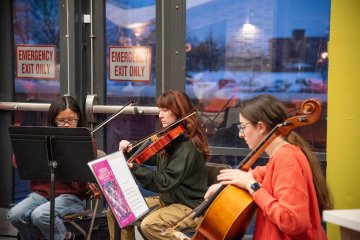 Utica University String Ensemble plays at the 2025 Holiday Dinner.