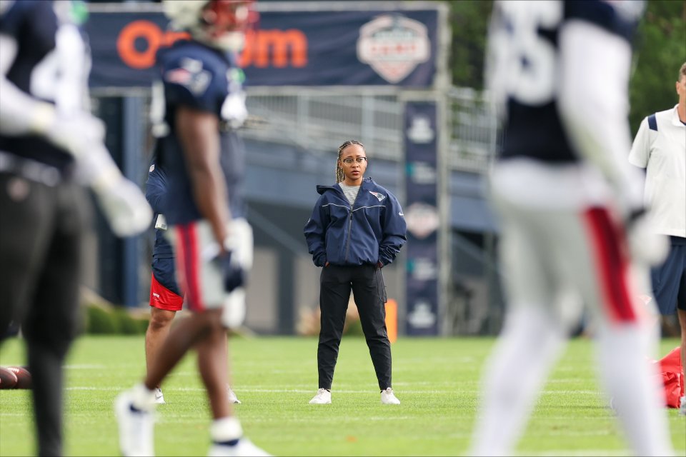 Maya Ana Callender on the field with the New England Patriots.